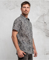 man in trippy print shirt with hidden eyes  made from 100% cotton