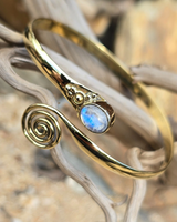 brass bracelet with swirl and moonstone gem