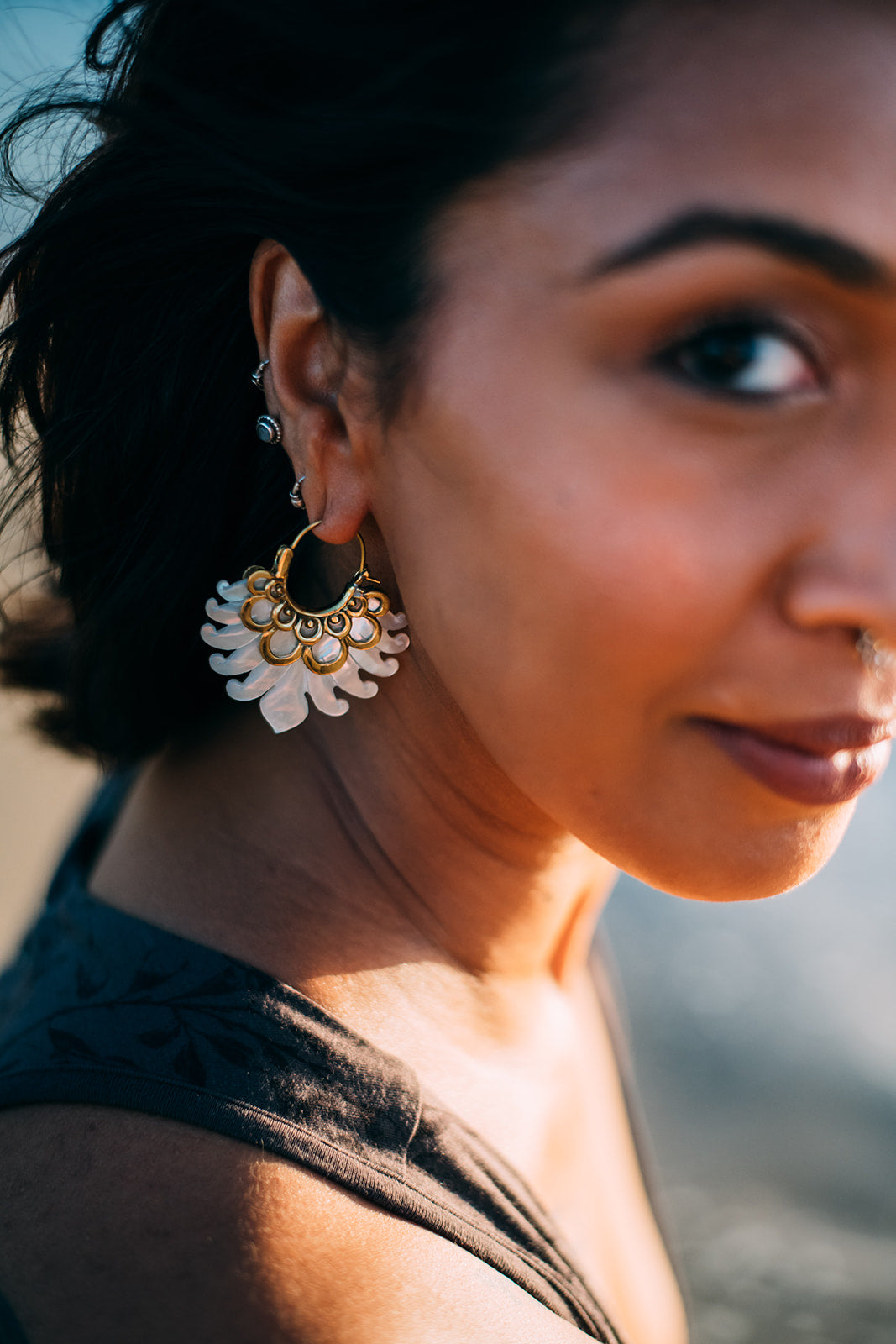 gorgeous mother of pearl earrings hand carved with brass finishings 