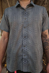 man in button up shirt with geometric print