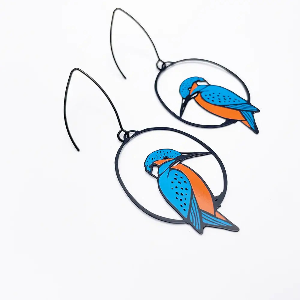 Bird-shaped earrings with blue and orange design on a white background