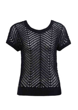 Black knit top on a white background