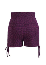 Purple patterned shorts with drawstring on a white background