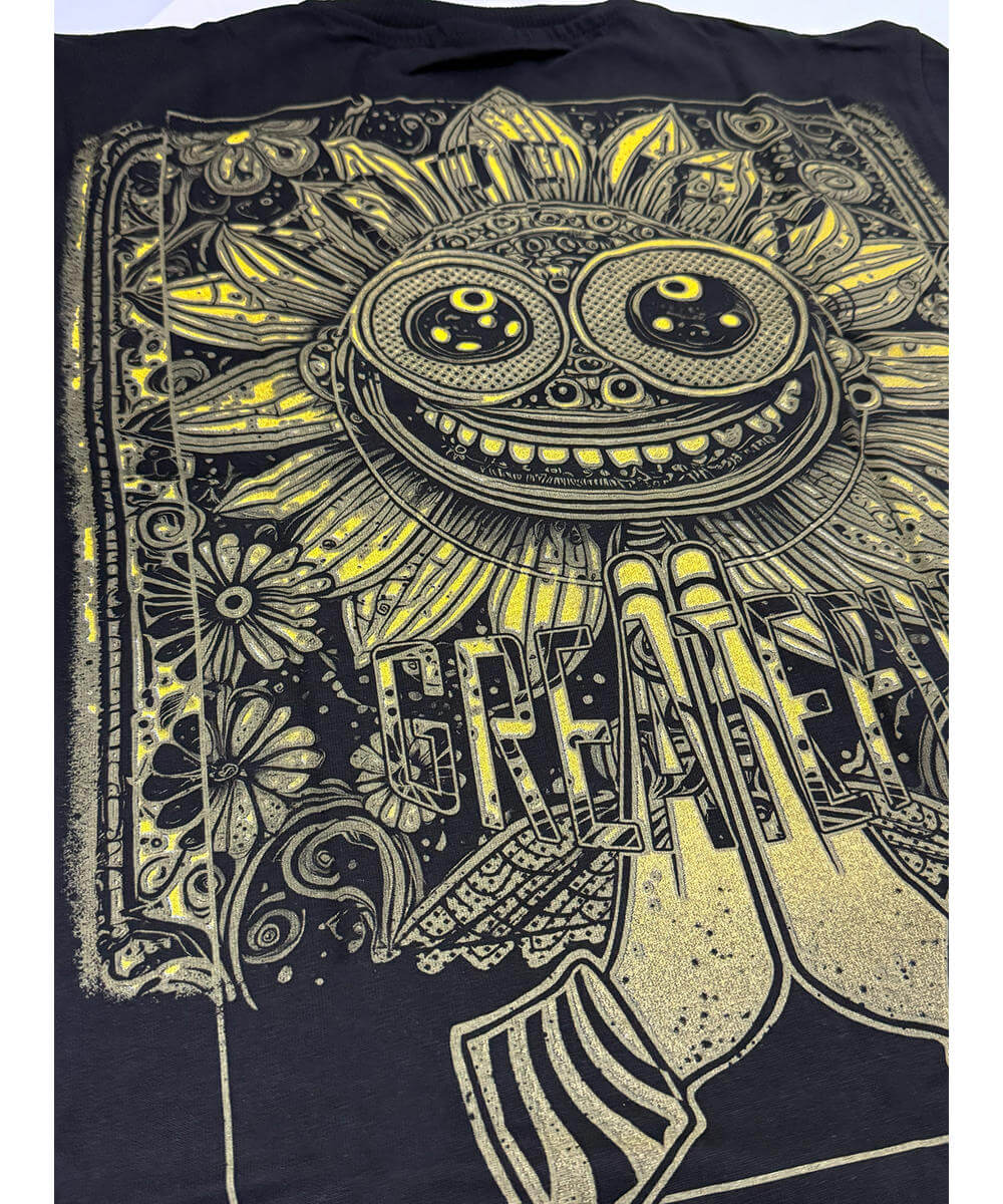 Black t-shirt with yellow intricate design on a white background