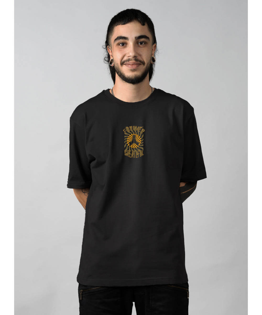 Person wearing a black t-shirt with a logo on a gray background