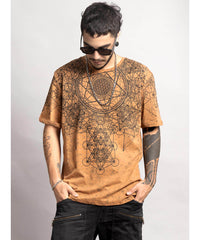 Man wearing a brown t-shirt with geometric designs on a plain background