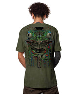 Person wearing a green t-shirt with a detailed graphic design on the back