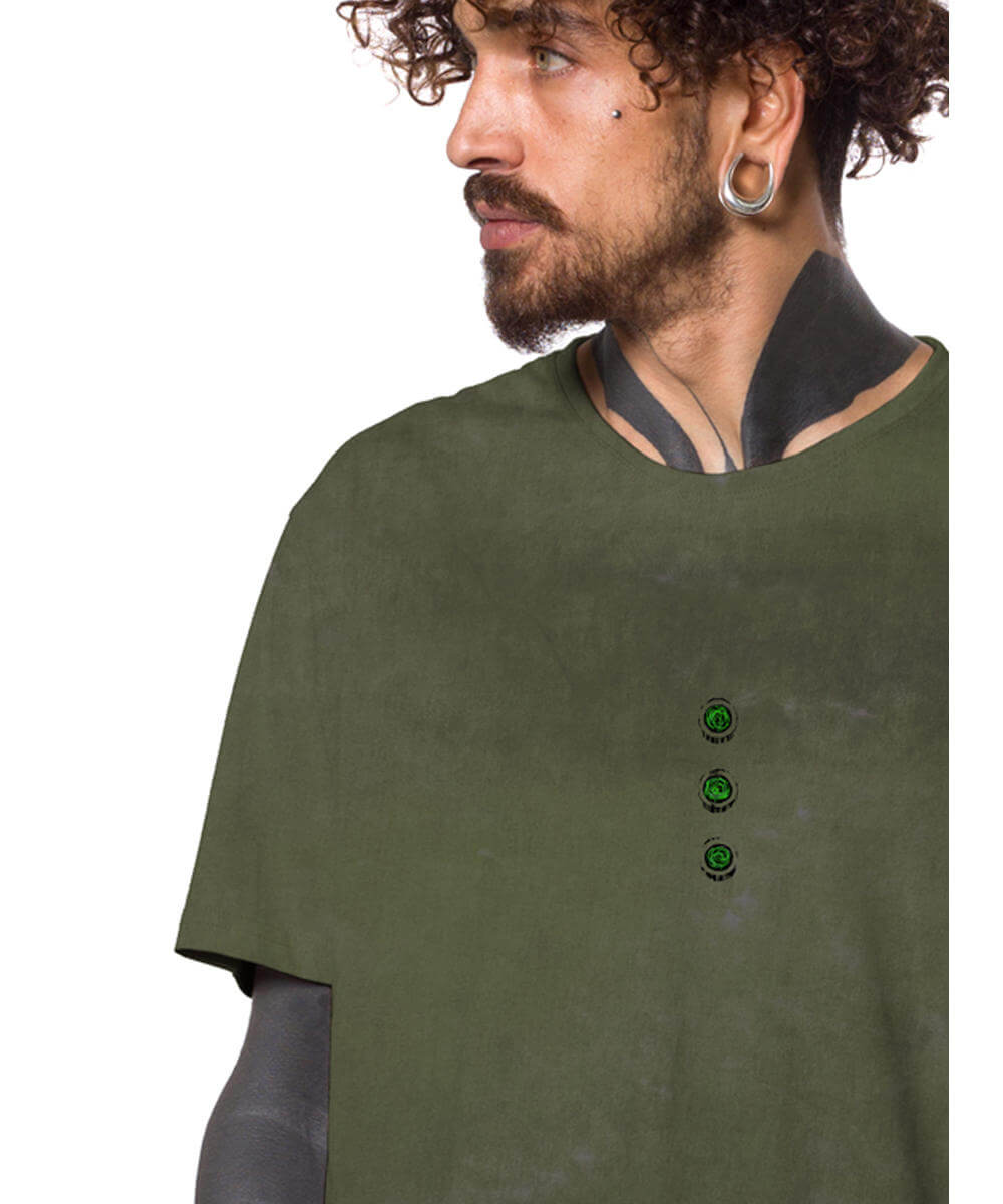 Person wearing a green shirt with three green buttons on a white background