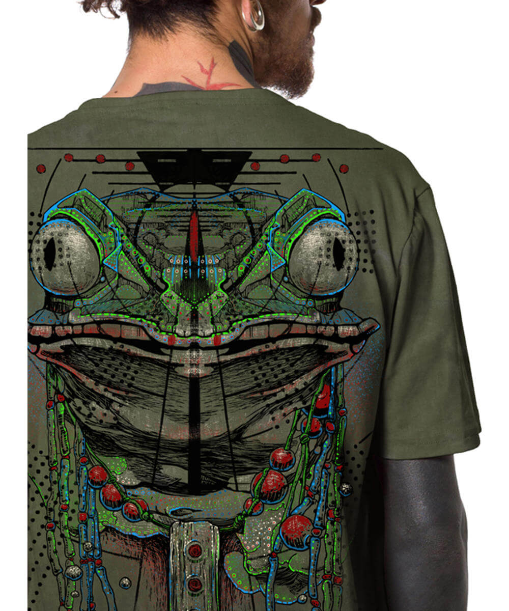 Person wearing a green t-shirt with a detailed frog-like creature design on the back.