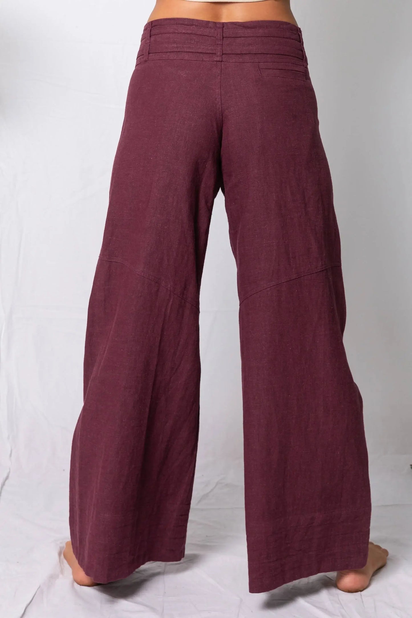 Maroon wide-leg pants on a white background