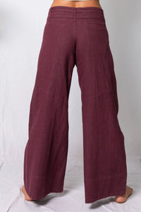 Maroon wide-leg pants on a white background