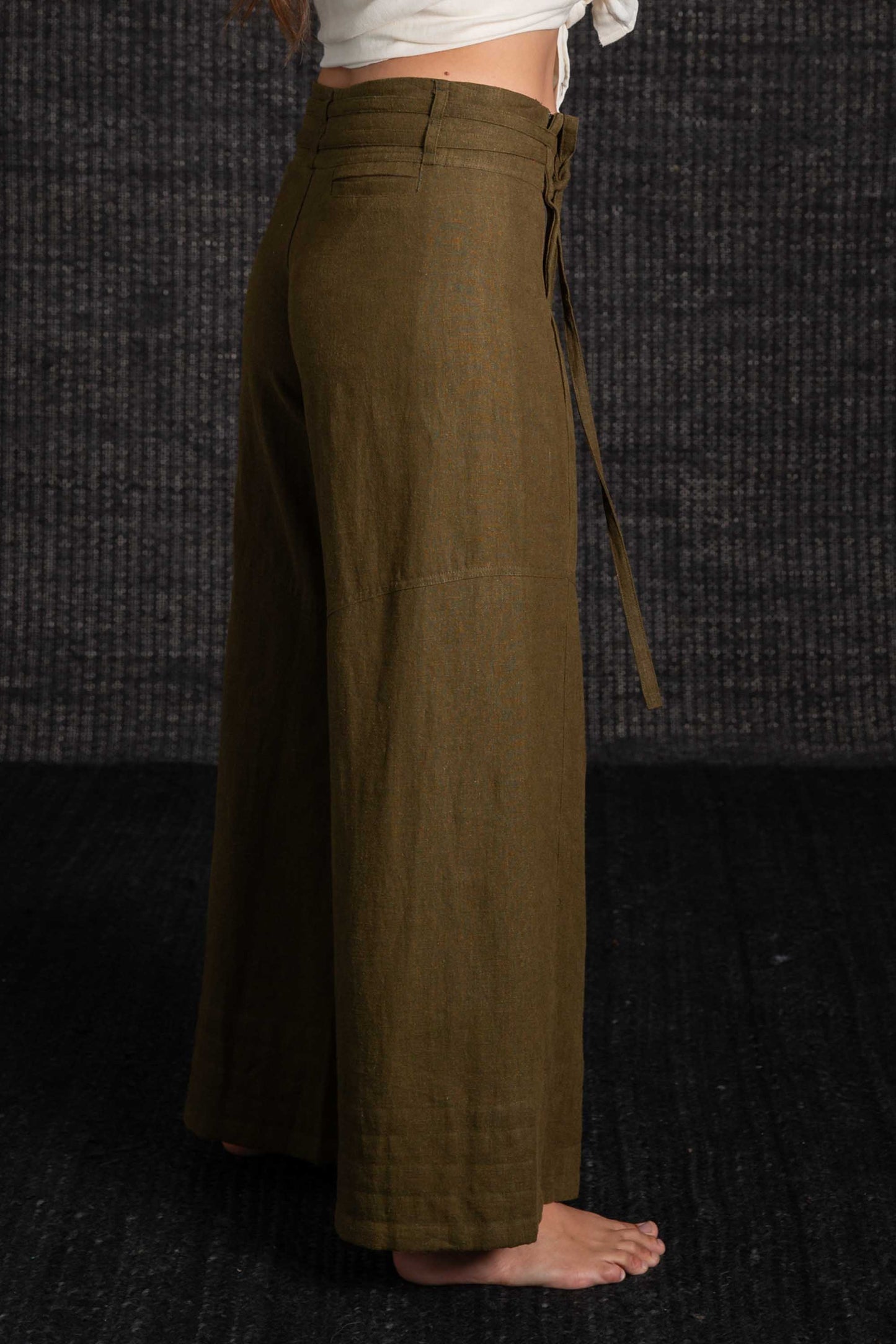 olive pants with black background
