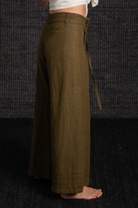 olive pants with black background
