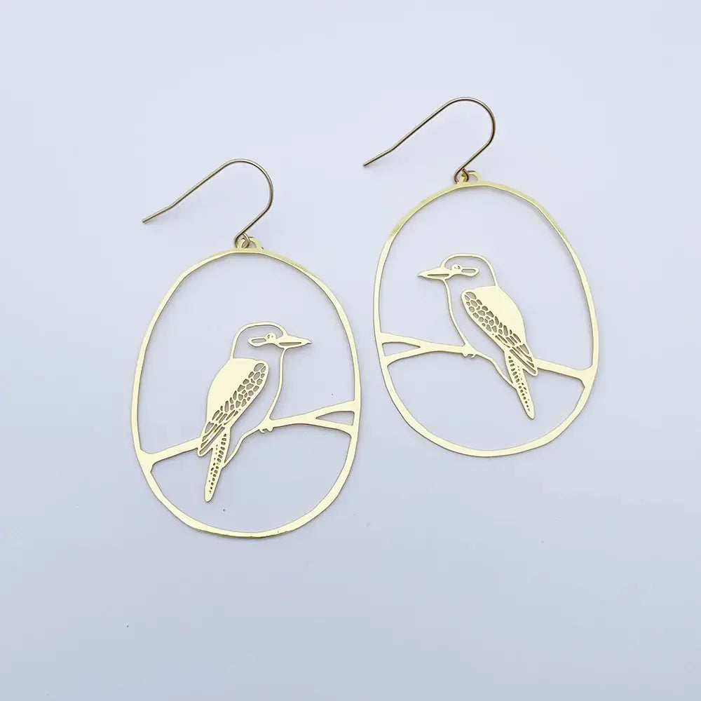Gold bird-shaped earrings on a light gray background