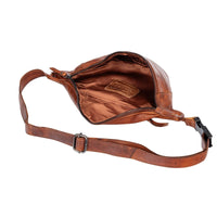Brown leather bag with a strap on a white background