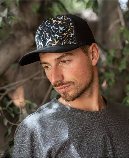 Man wearing MAAL baseball cap 
