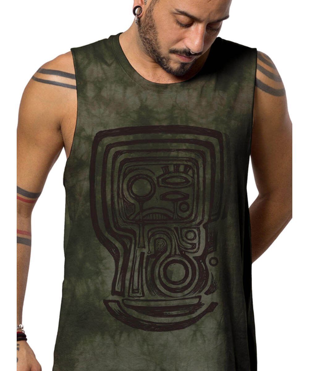 Man wearing a green tank top with a tribal design on a white background