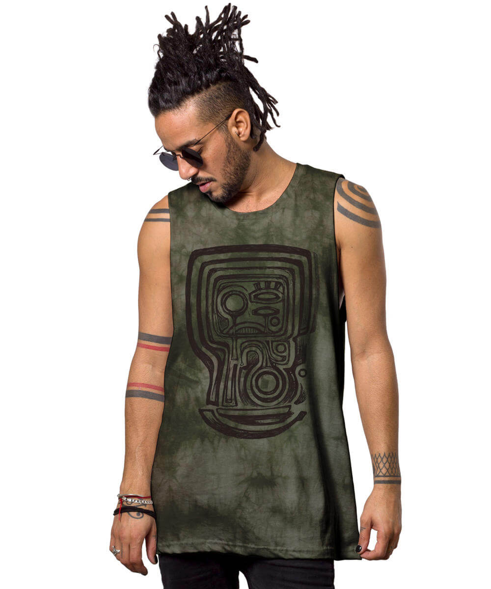 Man wearing a green sleeveless shirt with a tribal design on a white background