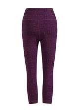 Purple patterned leggings on a white background