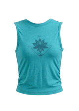 Turquoise tank top with a geometric floral design on a white background