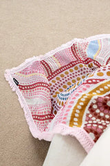 Three patterned pink cloths on a beige surface