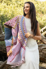 Woman wearing a colorful patterned shawl outdoors