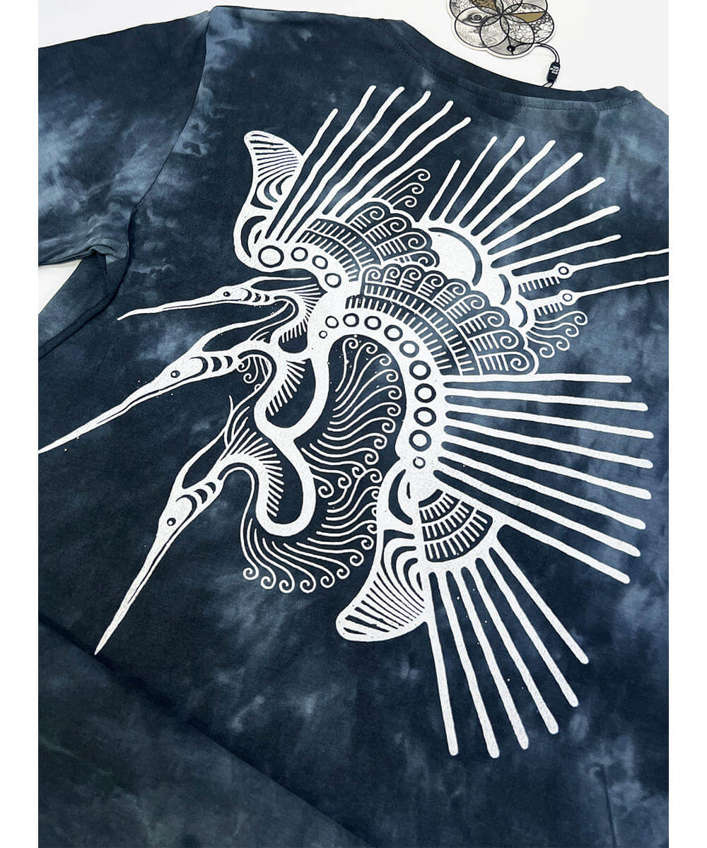 Tie-dye t-shirt with a white fish design on a blue background