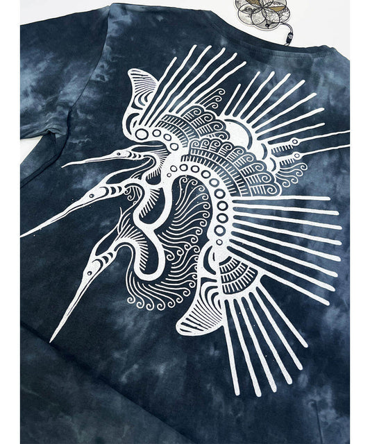 Tie-dye t-shirt with a white fish design on a blue background