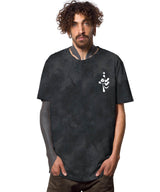 Man wearing a black t-shirt with a white logo on a white background