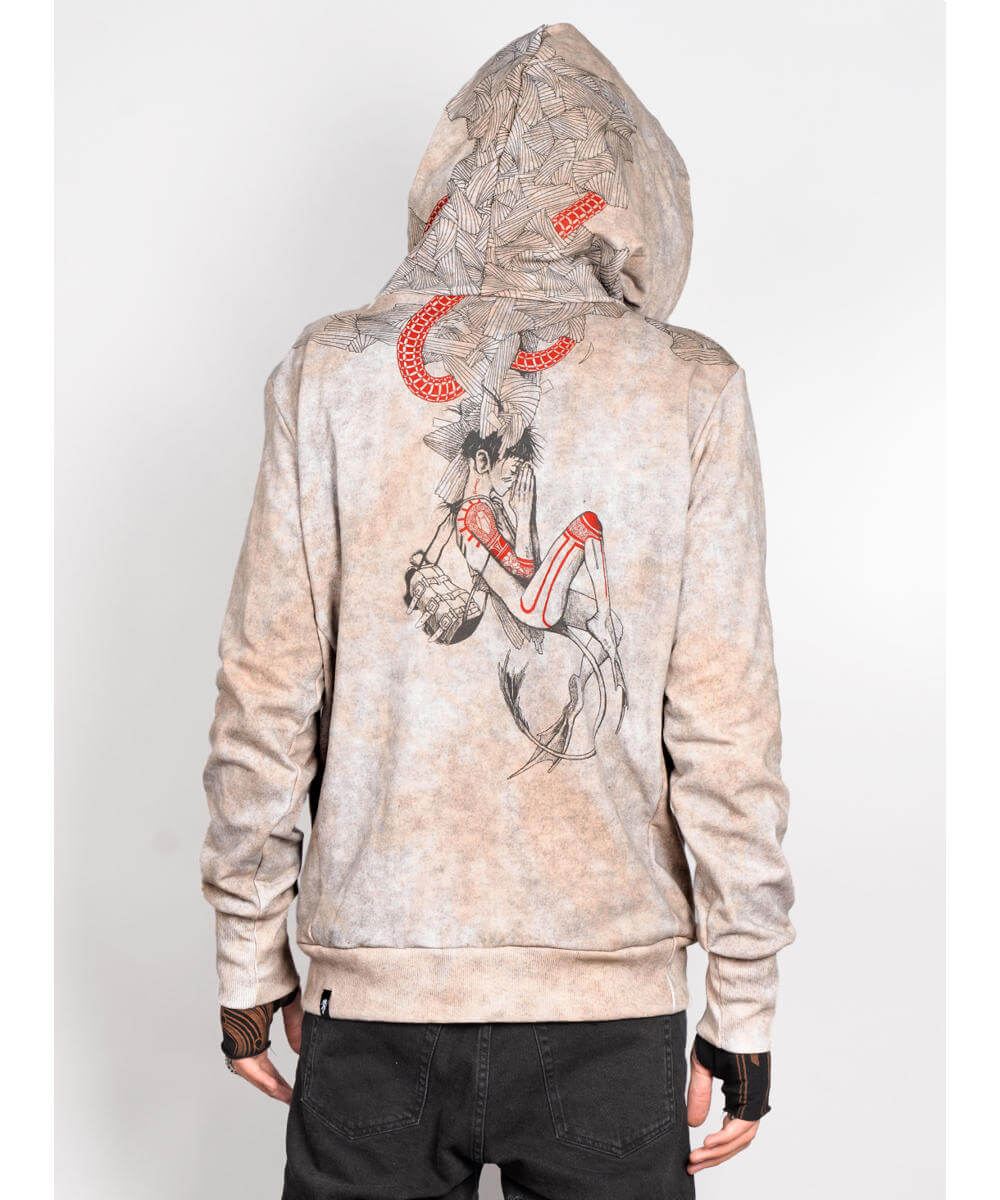 Beige hoodie with graphic design on the back, worn by a person against a white background