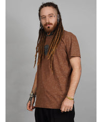 Man wearing a brown t-shirt with a logo on a gray background