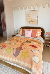 Abundance Art Throw Rug in earthy tones with colourful woven botanical and nature-inspired artwork