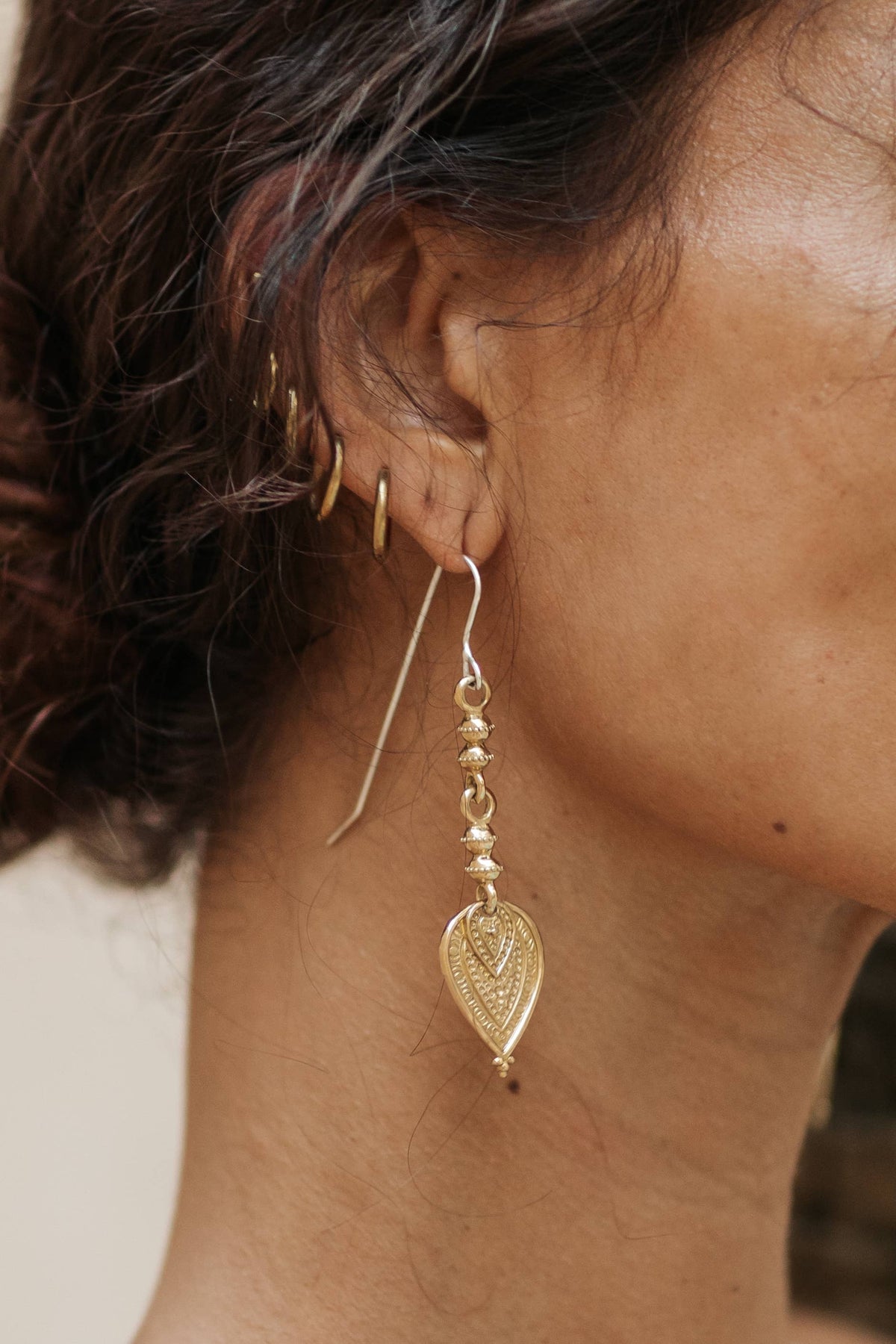 Aharya Earrings - Brass worn as long textured statement earrings with sterling silver hooks