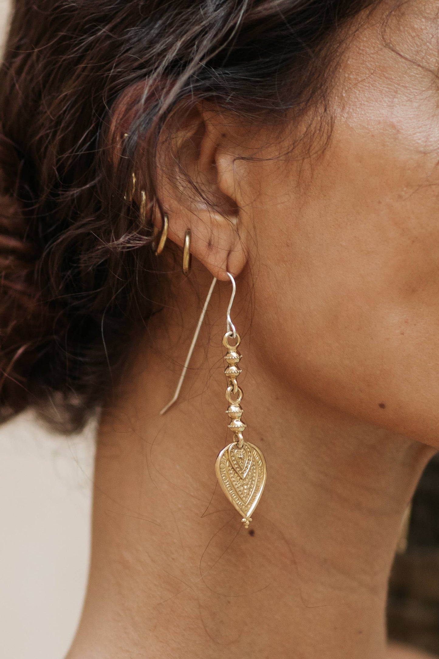 Aharya Earrings - Brass worn as long textured statement earrings with sterling silver hooks