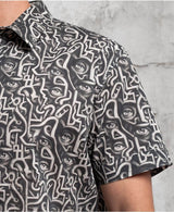 man in trippy print shirt with hidden eyes  made from 100% cotton