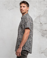 man in trippy print shirt with hidden eyes  made from 100% cotton