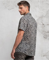 man in trippy print shirt with hidden eyes  made from 100% cotton