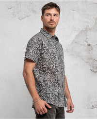 man in trippy print shirt with hidden eyes  made from 100% cotton