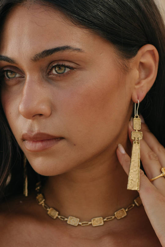 Ayana Earrings - Brass worn as long textured statement drop earrings