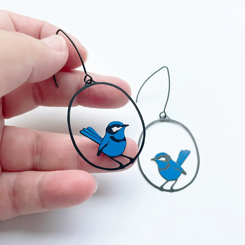 lady wearing blue wren earrings
