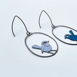 lady wearing blue wren earrings