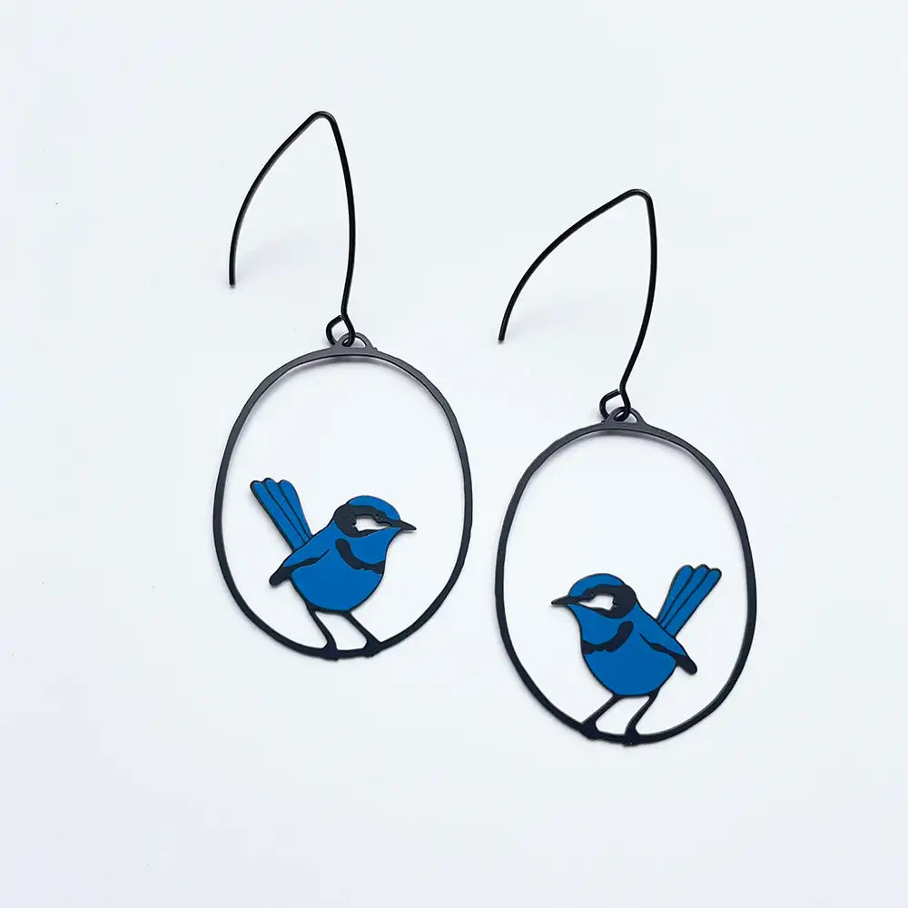 lady wearing blue wren earrings