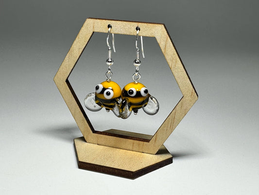 Close-up of Bumble Bee Glass Drop Earrings with playful googly eye details