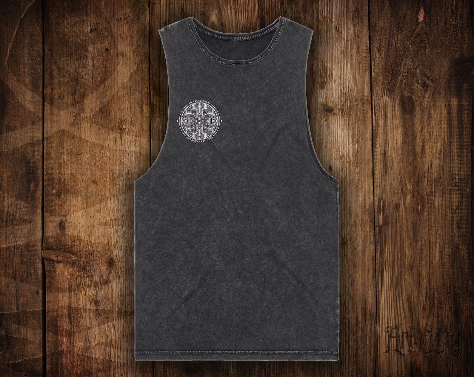 Black tank top with a geometric design on a wooden surface