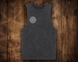 Black tank top with a geometric design on a wooden surface