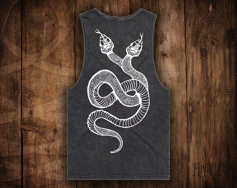 Black tank top with white snake design on a wooden background