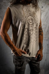 Person wearing a sleeveless shirt with a geometric pattern on a textured wall background