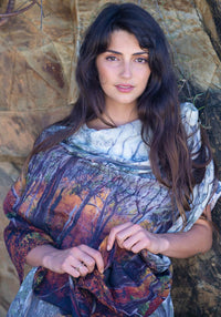 Woman wearing a SCARF printed with a fagus beech wood forest photograph with a natural stone background