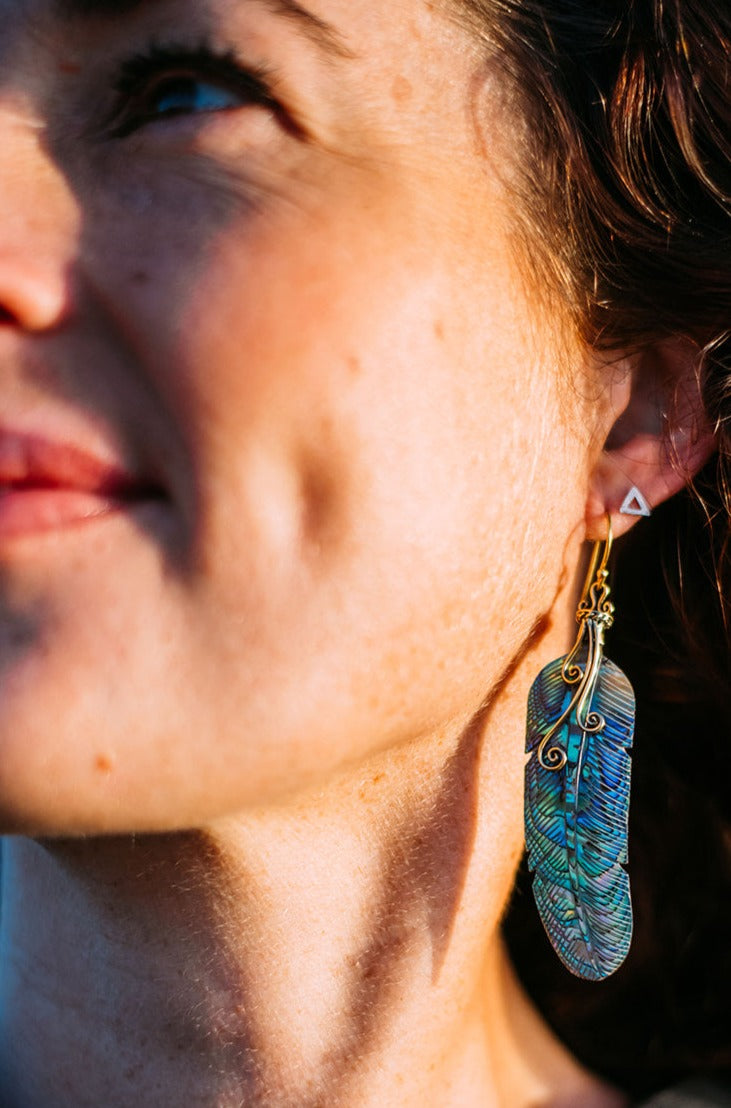 feather earring carved from paua shell with brass hook and swirl