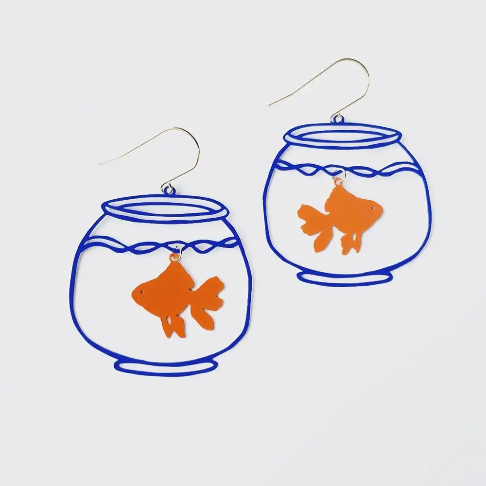 Pair of earrings with goldfish in bowls on a light gray background